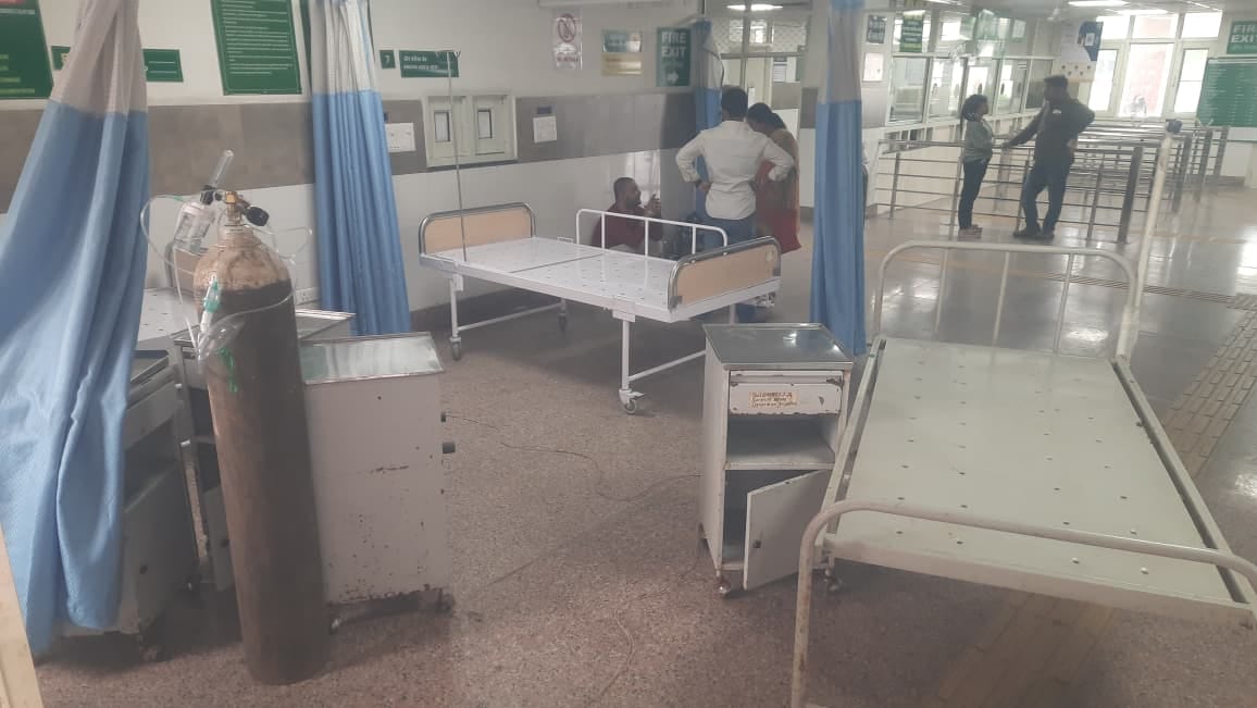 Emergency services operating in the veranda; two patients being treated on a single bed