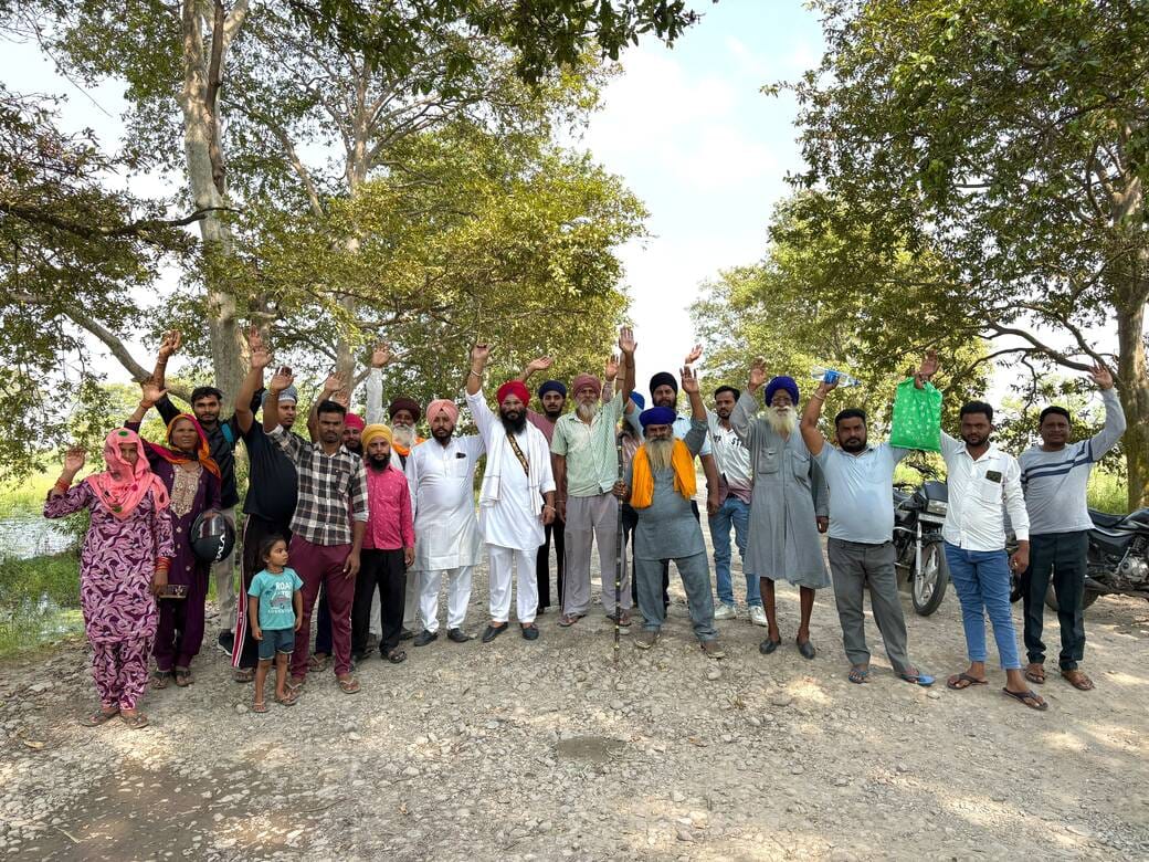 Villagers' anger erupts over road turned into a series of potholes.