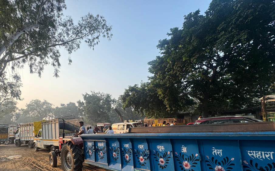 Paddy sales on roads cause trouble; school buses stuck in traffic jams.