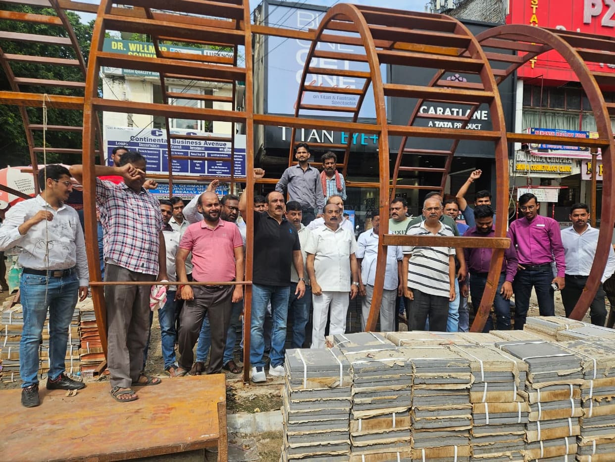Traders protest against the installation of 10-foot-high mesh screens in front of shops