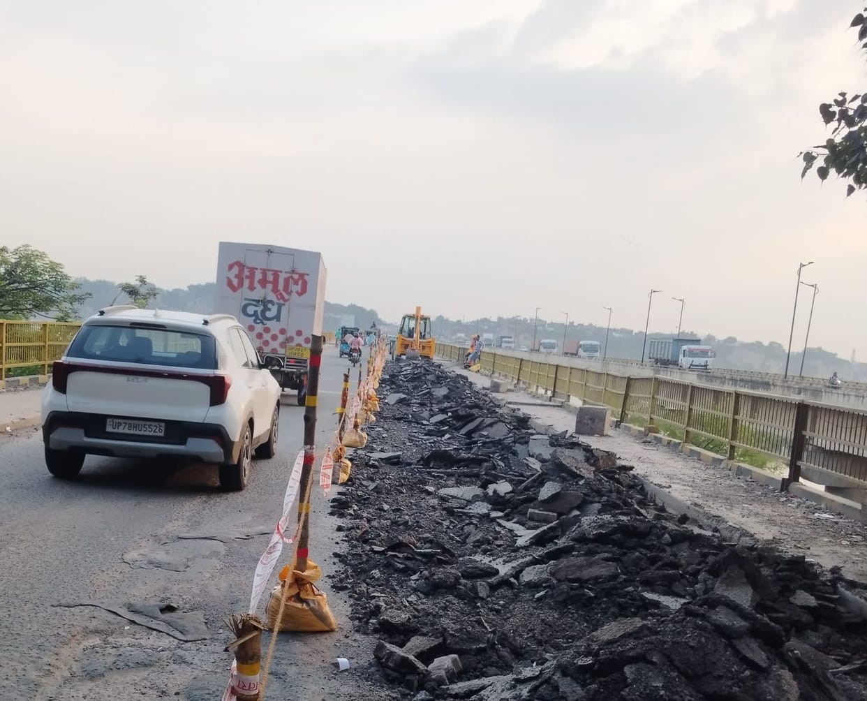 Repair work on the Jajmau Ganga bridge and road is underway.