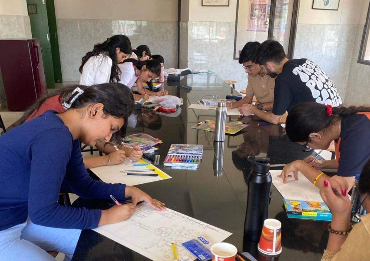 The team comprising Arnavi, Rohit, and Rishav stood first in the poster-making competition.