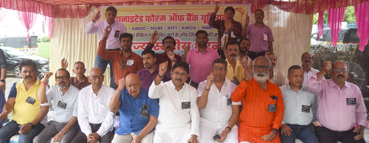 Bank employees worked wearing black badges; protest held at State Bank branch.