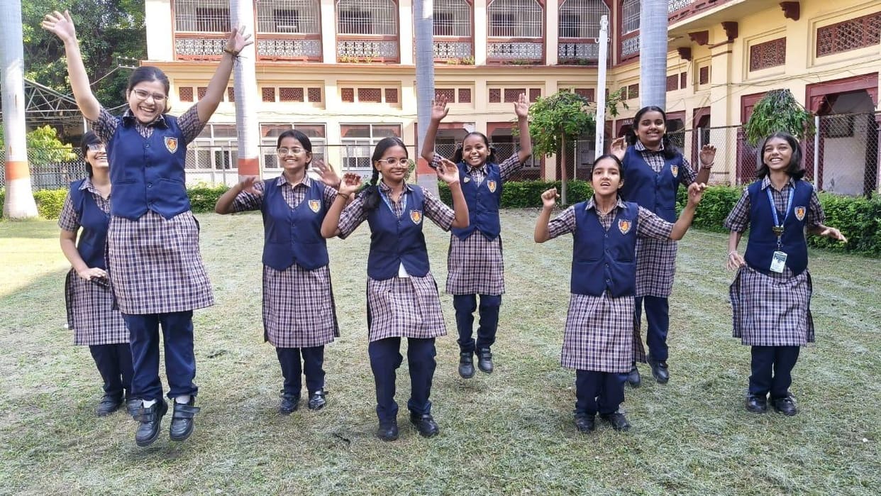 New uniform at Central Hindu Girls' School: blue jacket, trousers, and a checkered kurta instead of white.