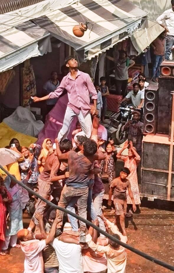 Hands raised in the air, the *Dahi Handi* shattered, and Soron Gate echoed with resounding cheers.