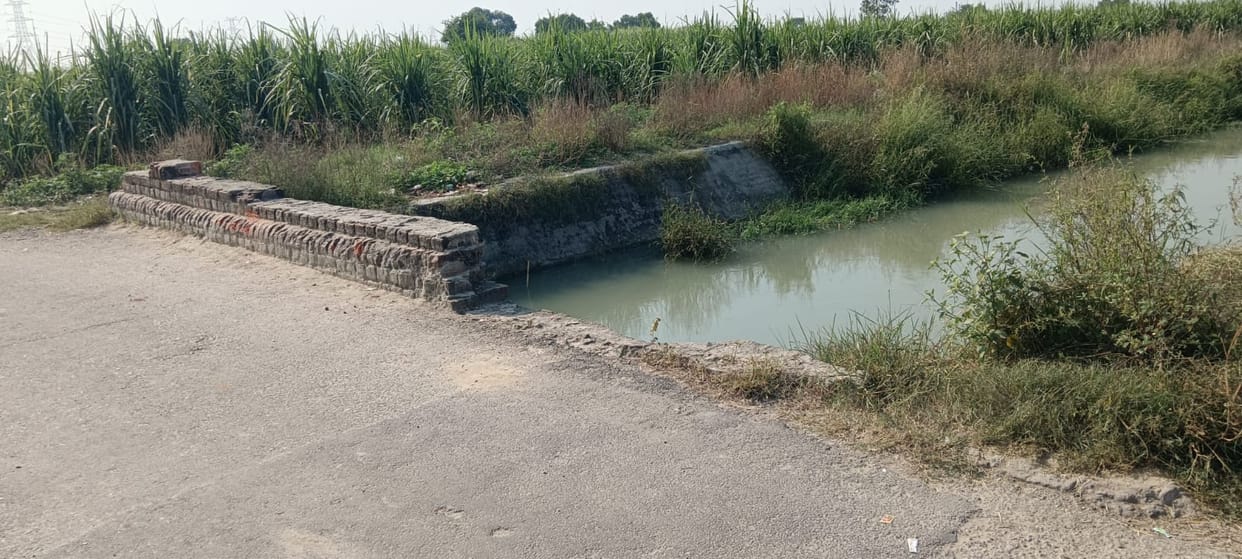 Moped falls into distributary through damaged wall; youth dies.