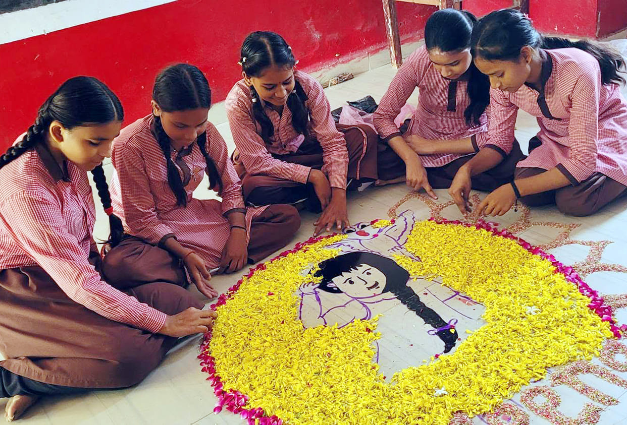 Meena's daughters decorated a rangoli for her birthday.
