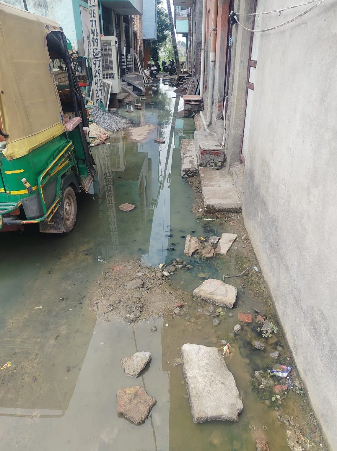 Sewage overflow floods the streets of Subhash Nagar with dirty water.