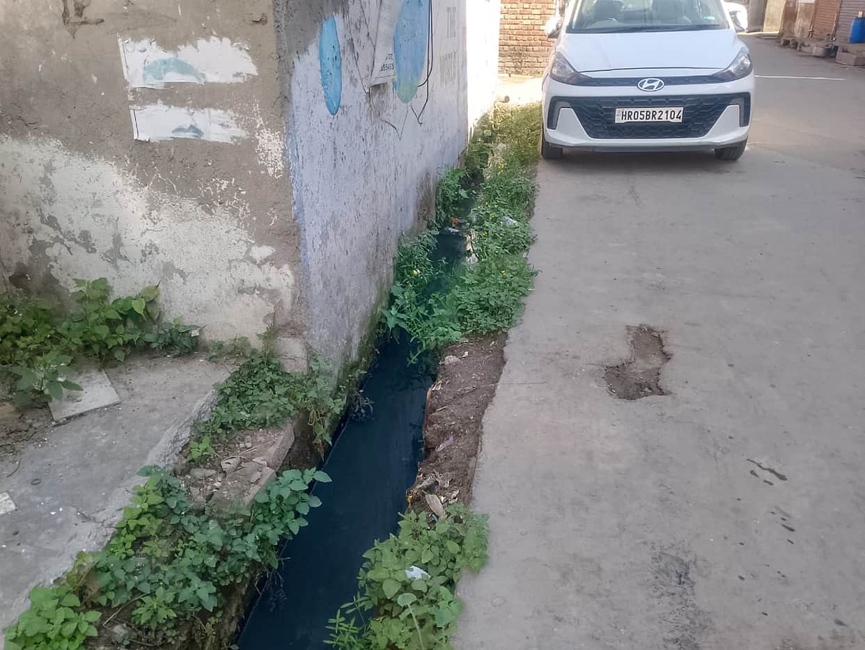 Workers forgot to install slabs after cleaning the drains.