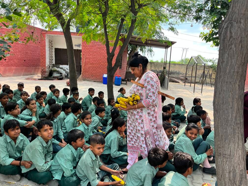 Children left with empty plates amidst teachers' tussle; bananas distributed instead.