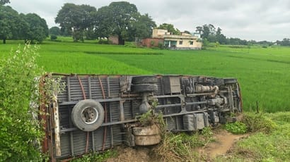 Driver dozed off; DCM overturned on the side of the four-lane highway.