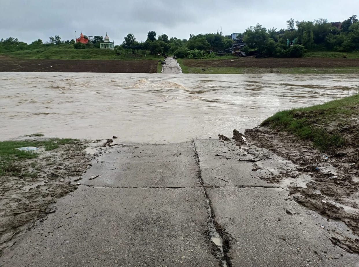 Floodwaters cover the Chandraval causeways; traffic movement halted.Floodwaters cover the Chandraval causeways; traffic movement halted.