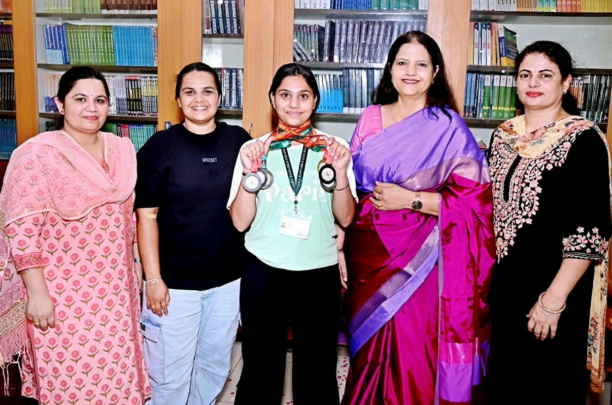 Khushi welcomed upon returning to college after winning six medals.