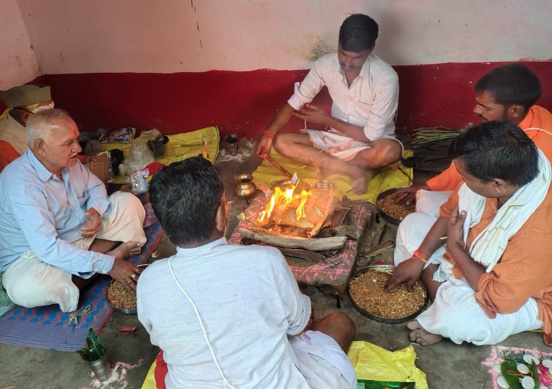 After worshipping the village deity, offerings were made into the sacrificial fire.