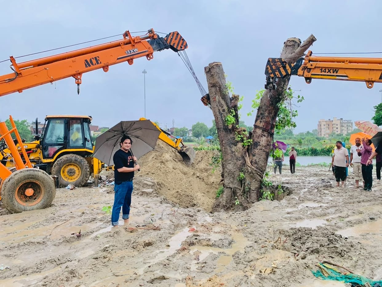 80-year-old Peepal and 50-year-old rubber tree relocated due to Anant Nagar project.