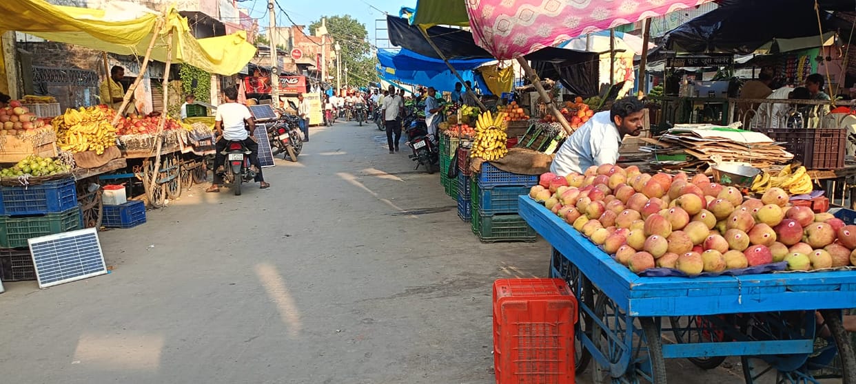 Makeshift shops lined both sides of the road... narrowing the passage.