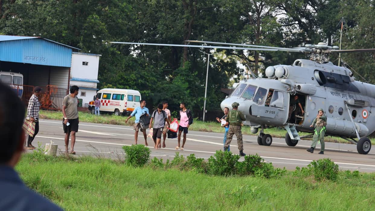 Administration's rescue operation amidst floods; 6 employees airlifted to safety.
