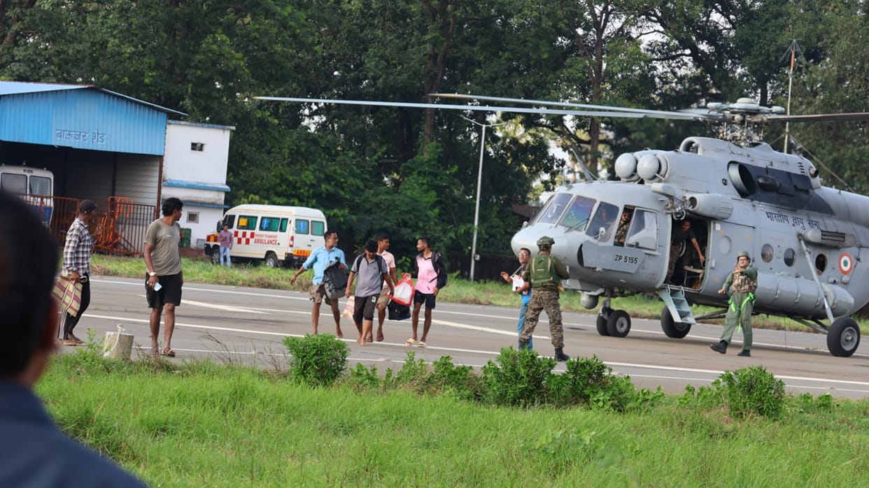 Administration's rescue operation amidst floods; 6 employees airlifted to safety.