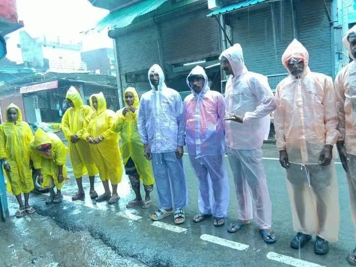 Raincoats distributed to sanitation workers on duty during the rain