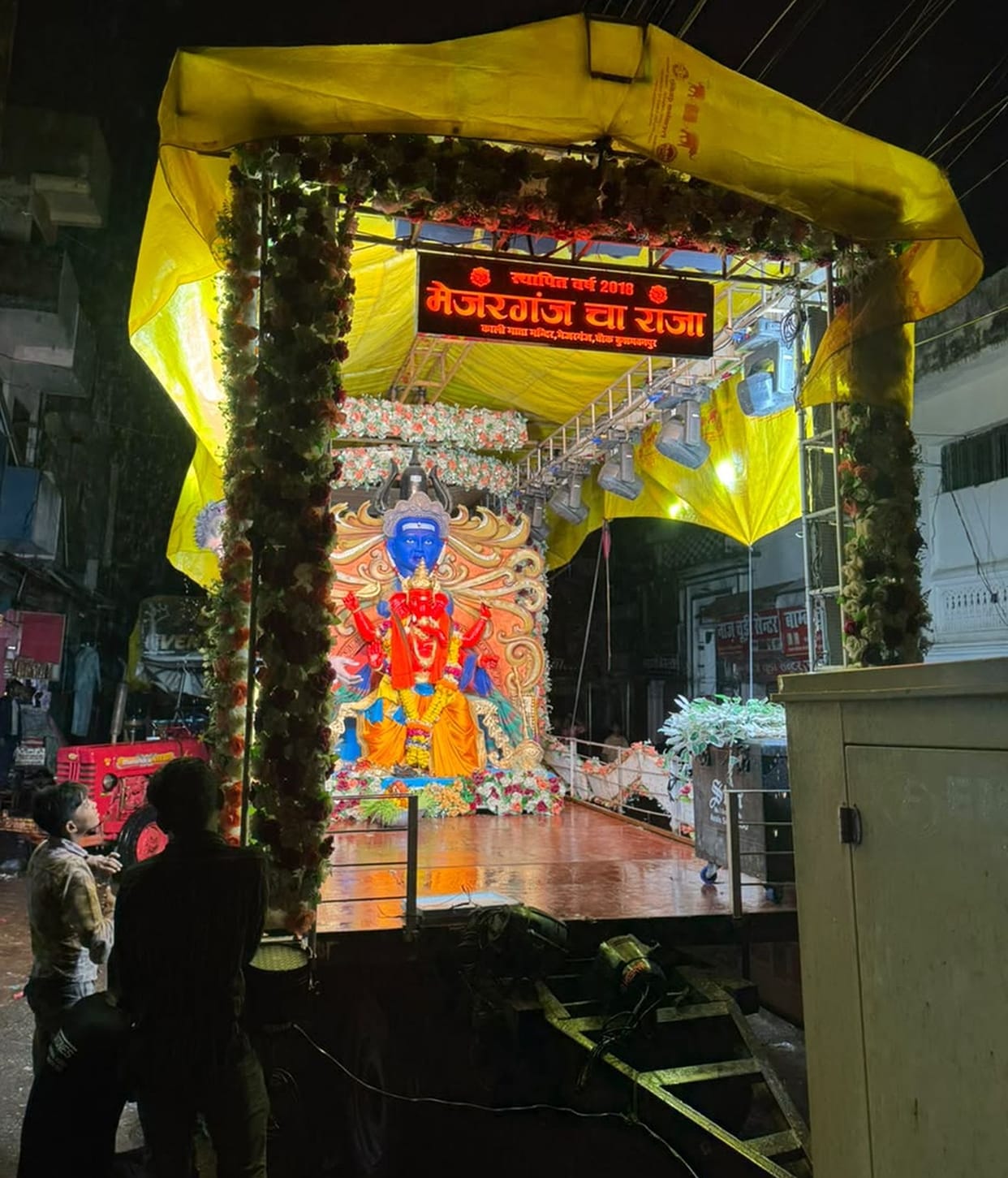 Ganpati procession amidst a light drizzle; city echoes with chants