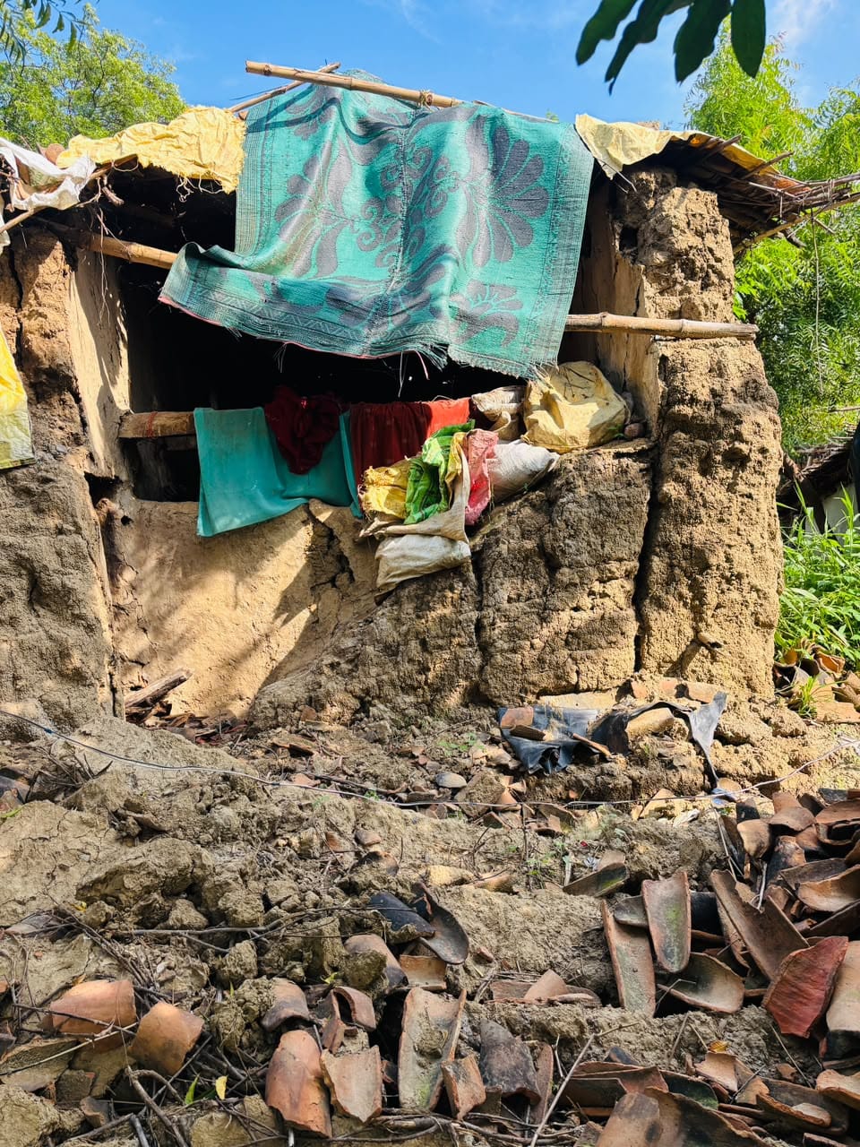Seven mud houses collapsed in the rain; families left homeless.
