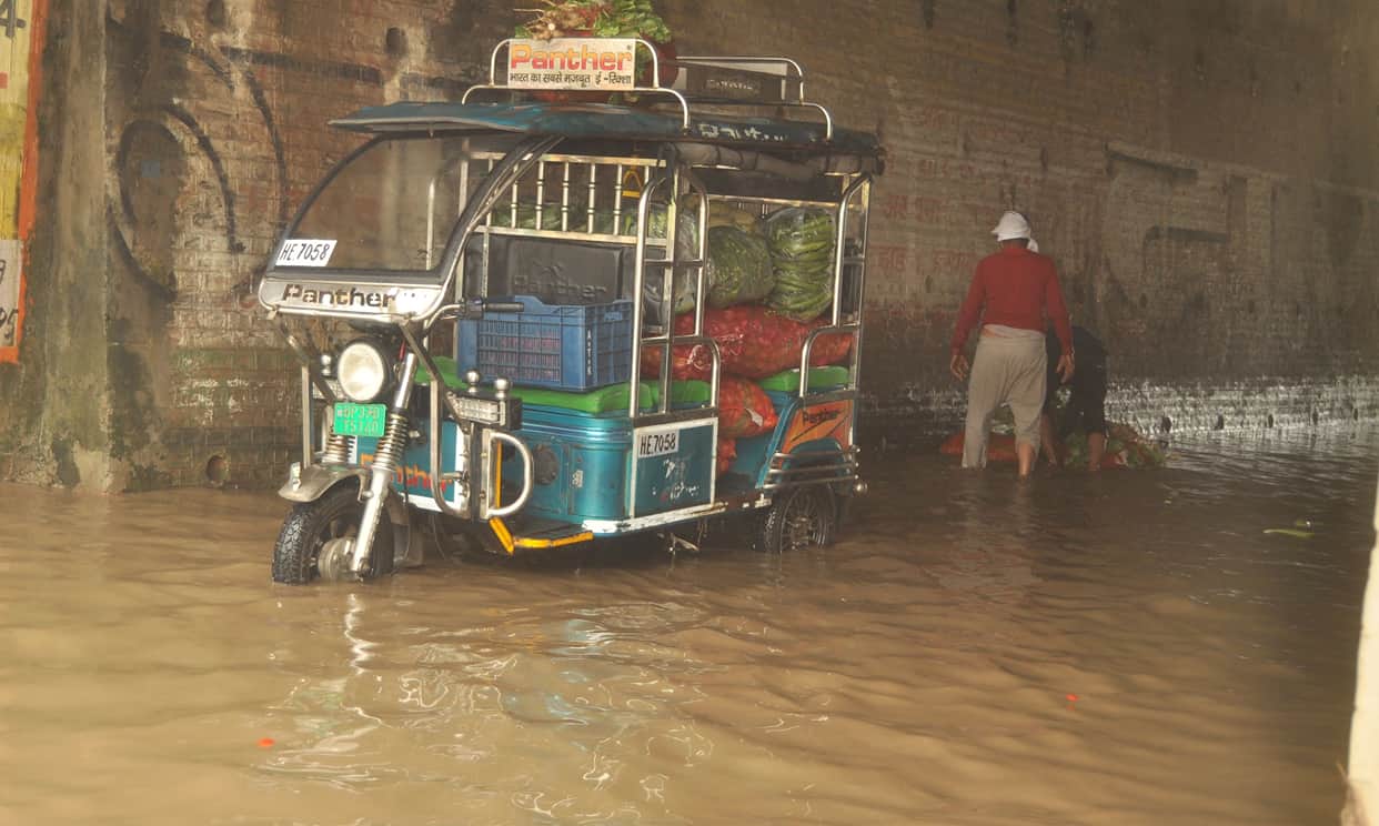 Rain leaves underpasses and service roads waterlogged; several vehicles get stuck and break down