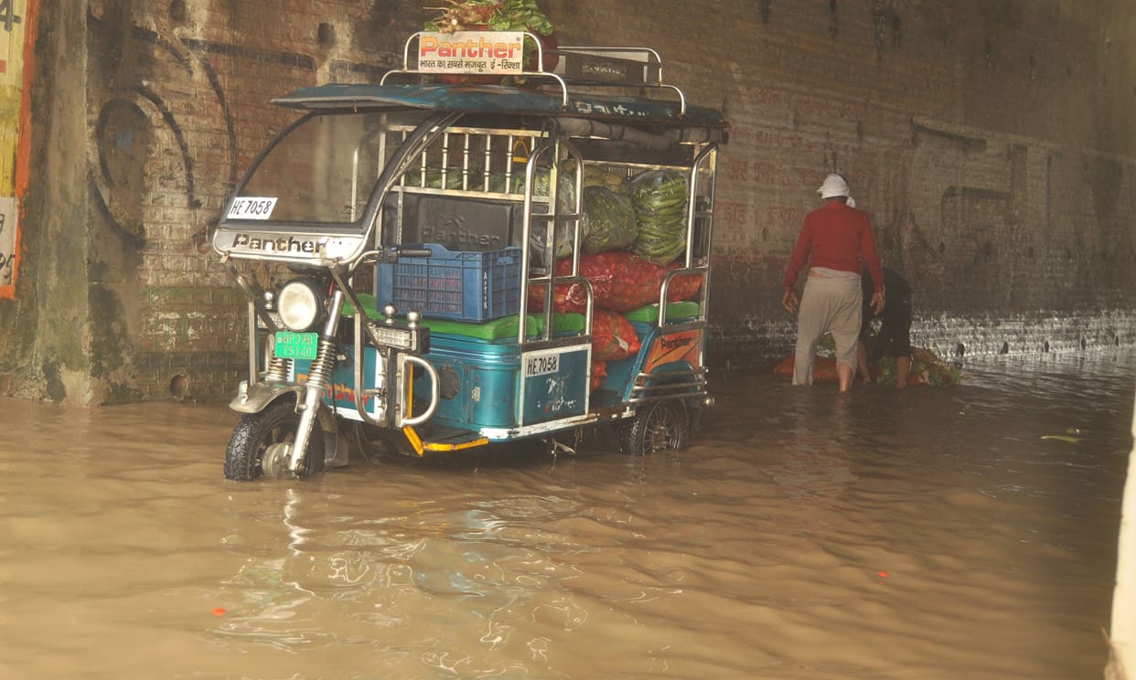 Rain leaves underpasses and service roads waterlogged; several vehicles get stuck and break down