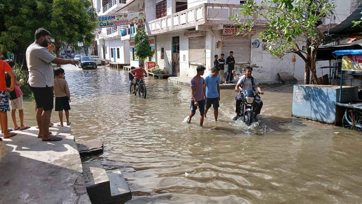 Water inside the homes, families outside.