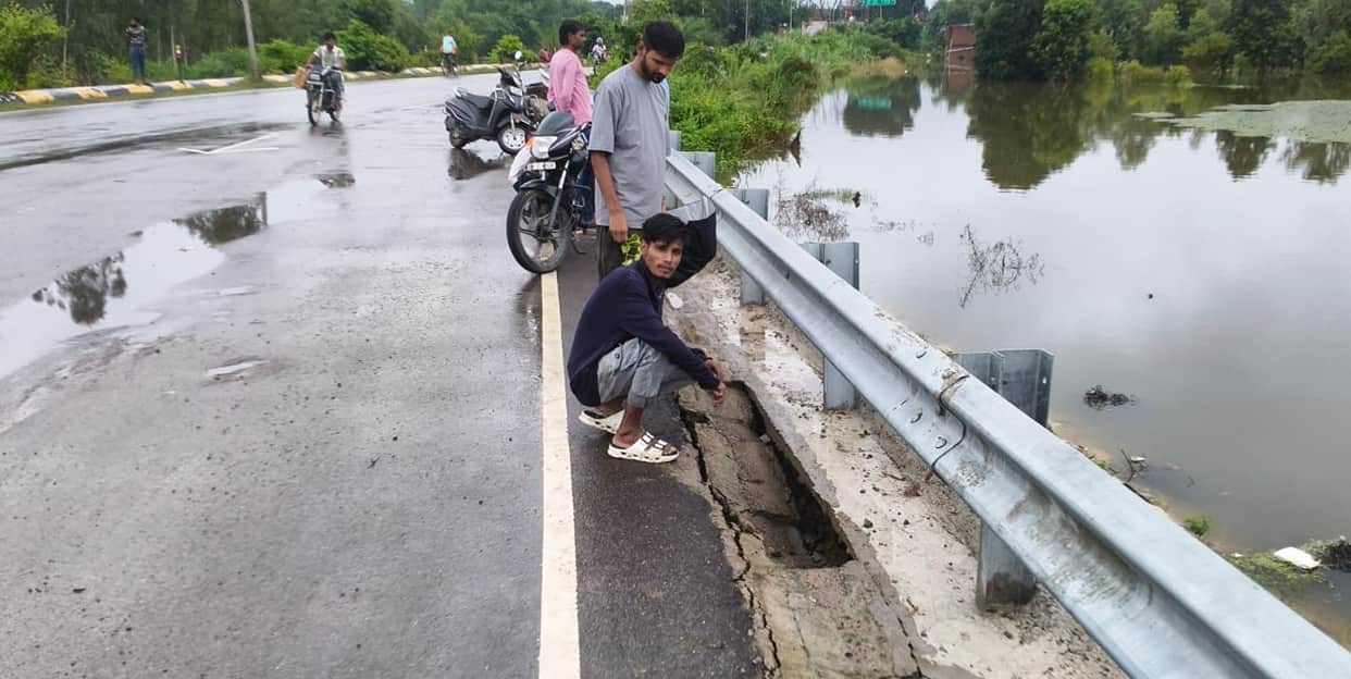 215 mm of rain in 66 hours; bridge approach road caves in.