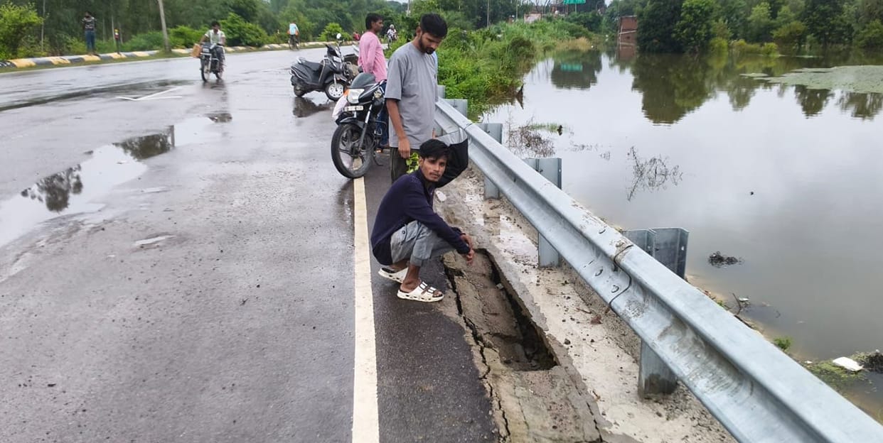215 mm of rain in 66 hours; bridge approach road caves in.
