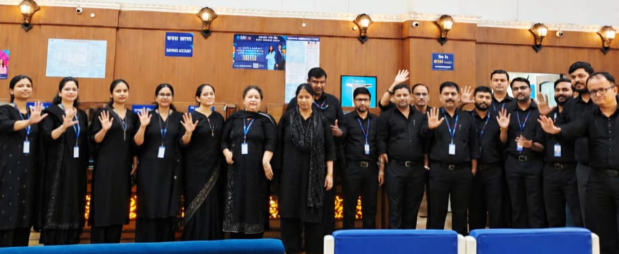 Bank employees worked while wearing black armbands.