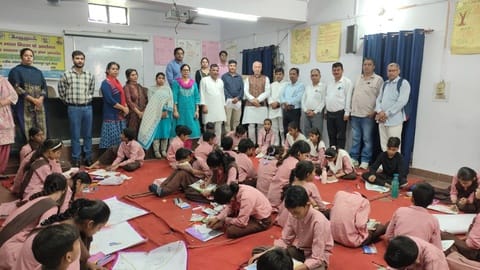 Anganwadi workers honored with sarees.