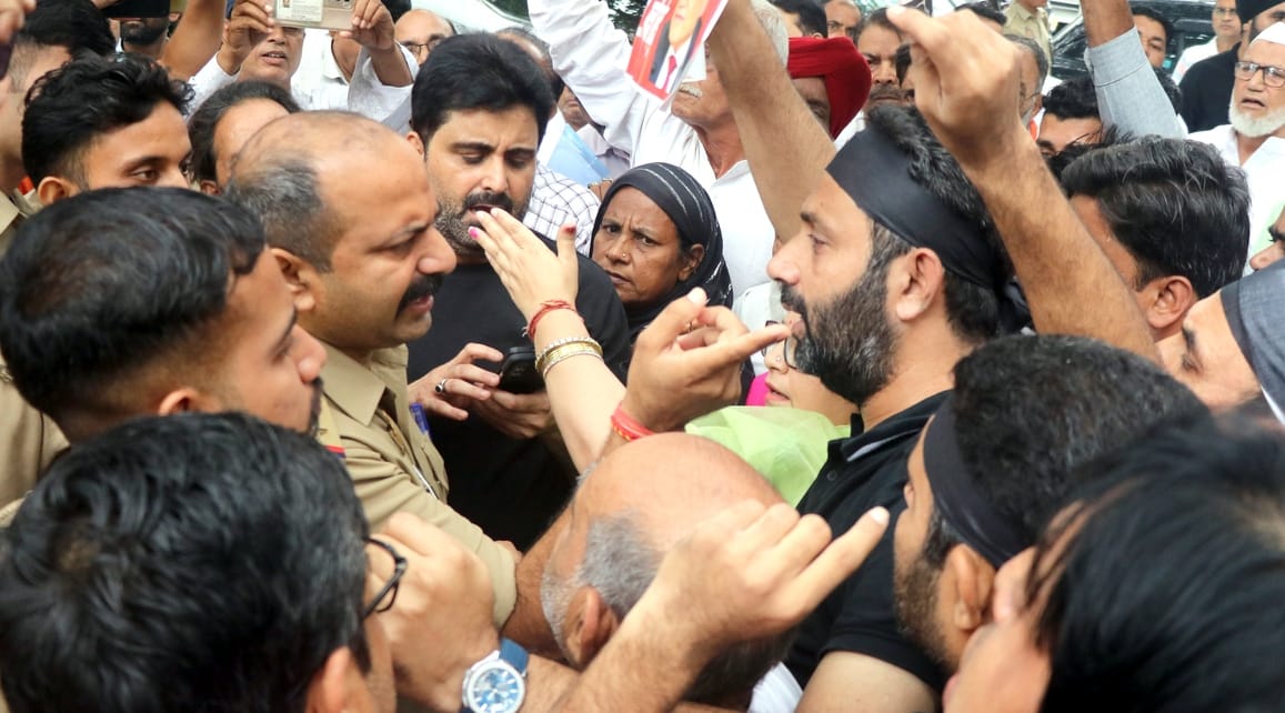 Congress members wearing black armbands who entered the Collectorate were removed; a heated exchange ensued.