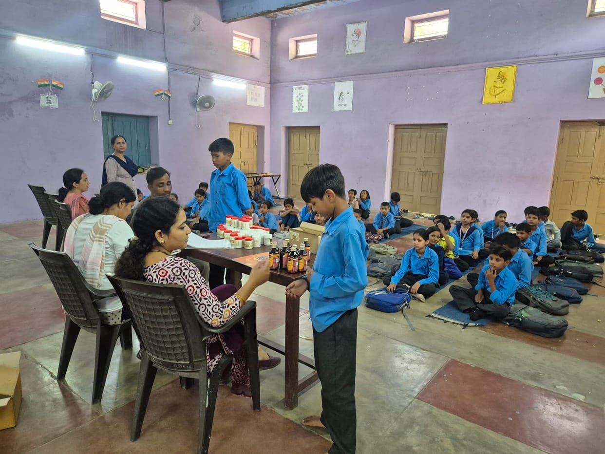 Students informed about the benefits of yoga at the AYUSH camp.