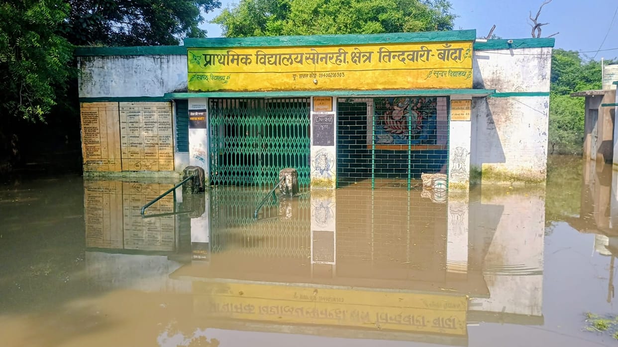 School turns into a pond; classes held at former village head's house.