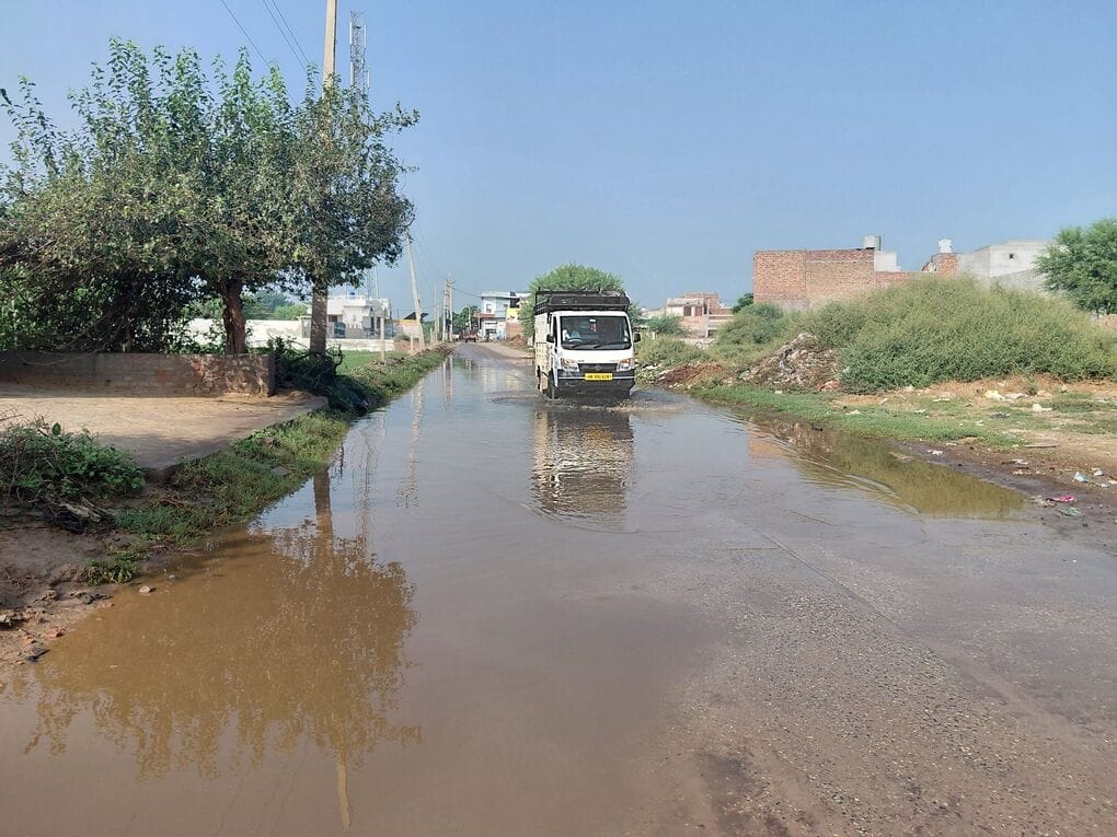 Sewage water floods the road in Uchana Kalan, causing inconvenience to residents.