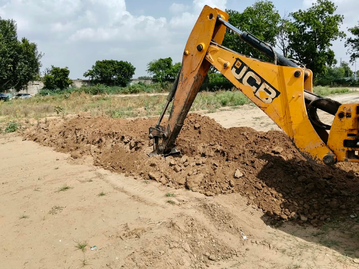 Administration's bulldozer razes illegal colony.