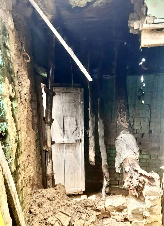 Household goods destroyed after being buried under debris following the collapse of a house roof.