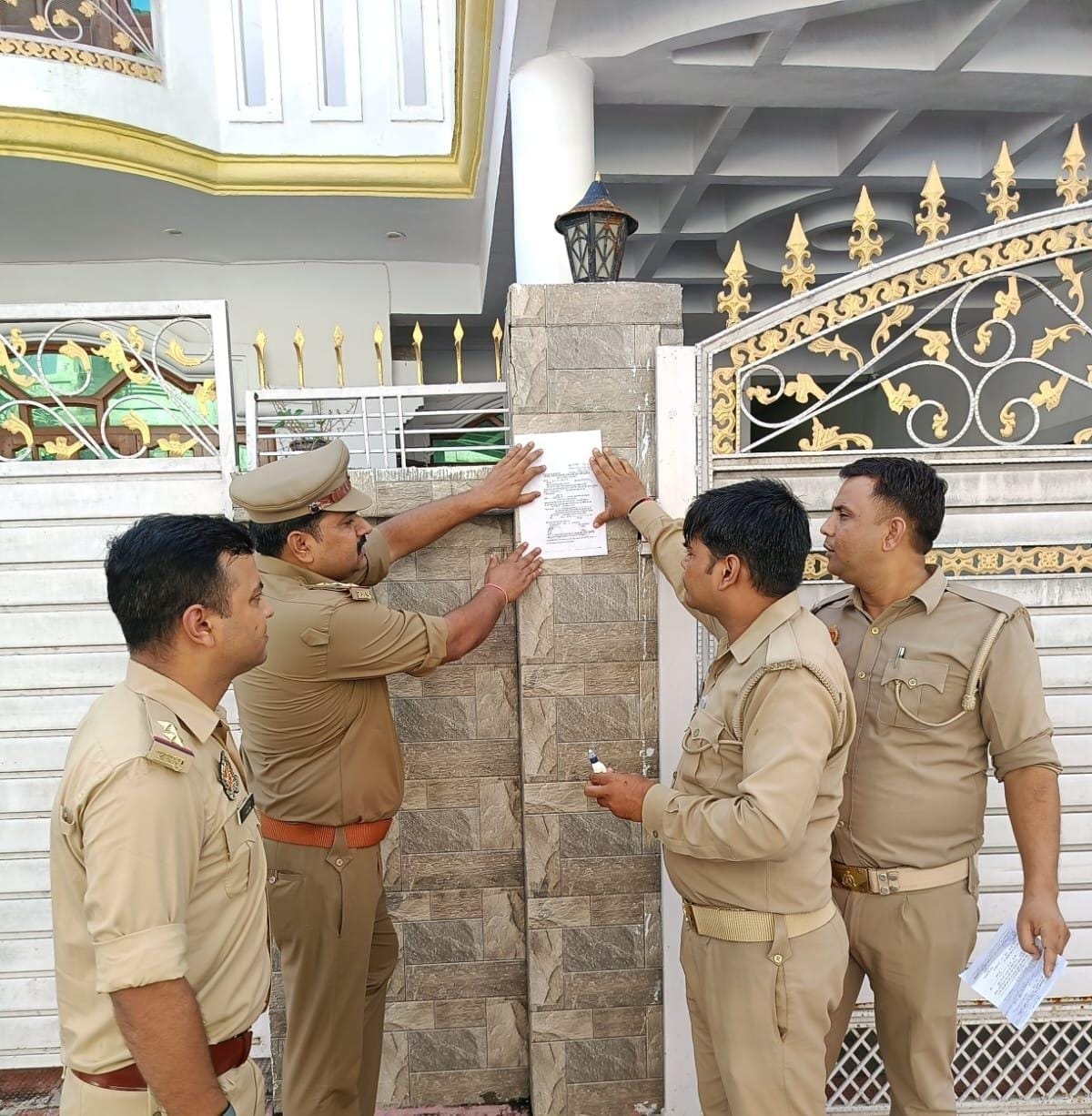 Attachment notice pasted on the house of the rape accused