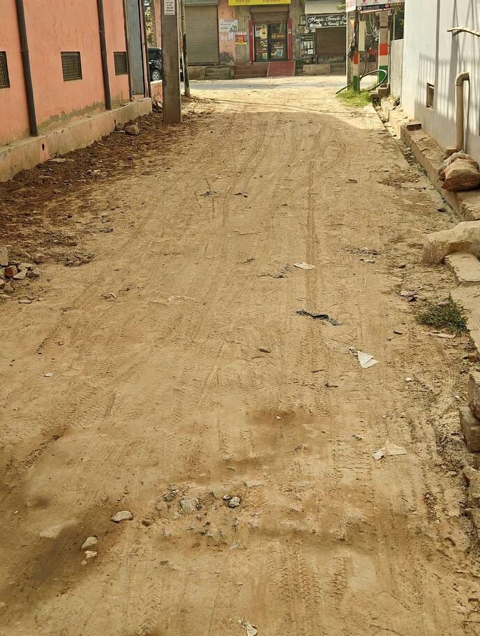Construction of 200-foot interlocking road remains incomplete even after a year and a half.