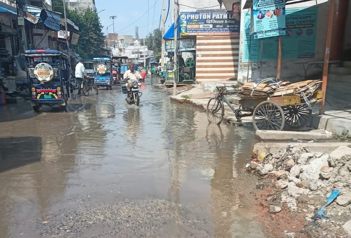 Sewer line blocked on Barahi Road; contaminated water floods the street, causing distress to