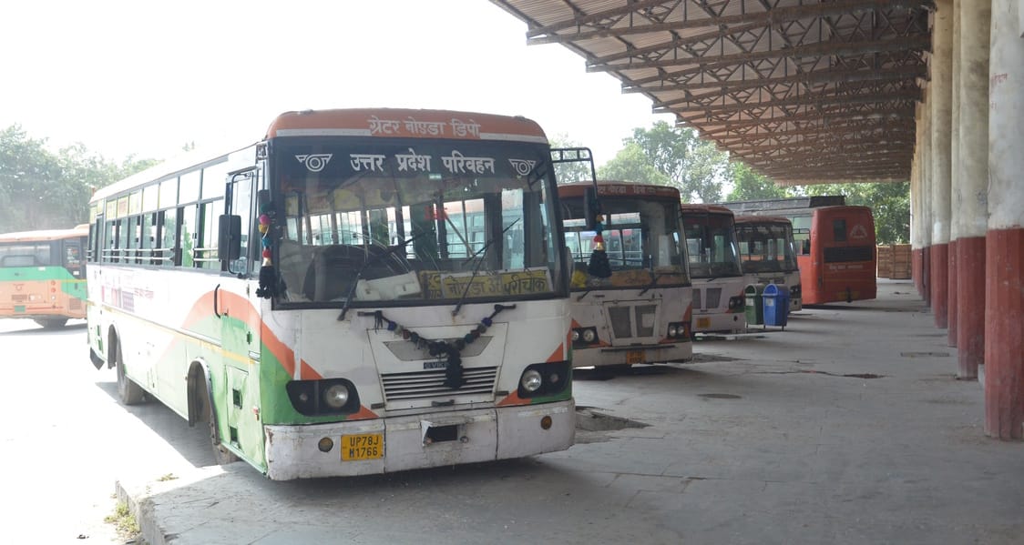 Buses wait for passengers at the Kasna bus stand.