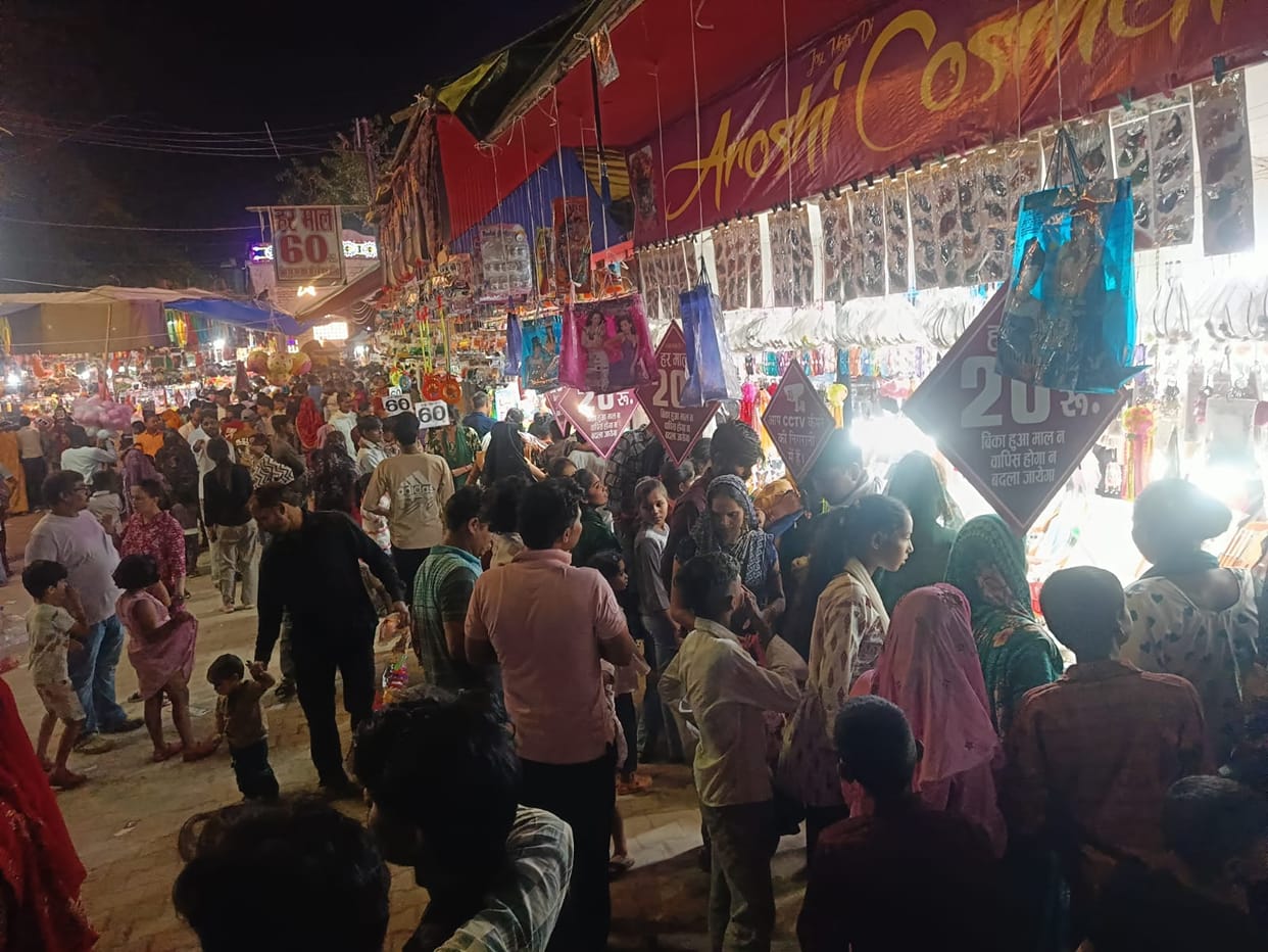 Women are picking up home decor items from the fair's market.