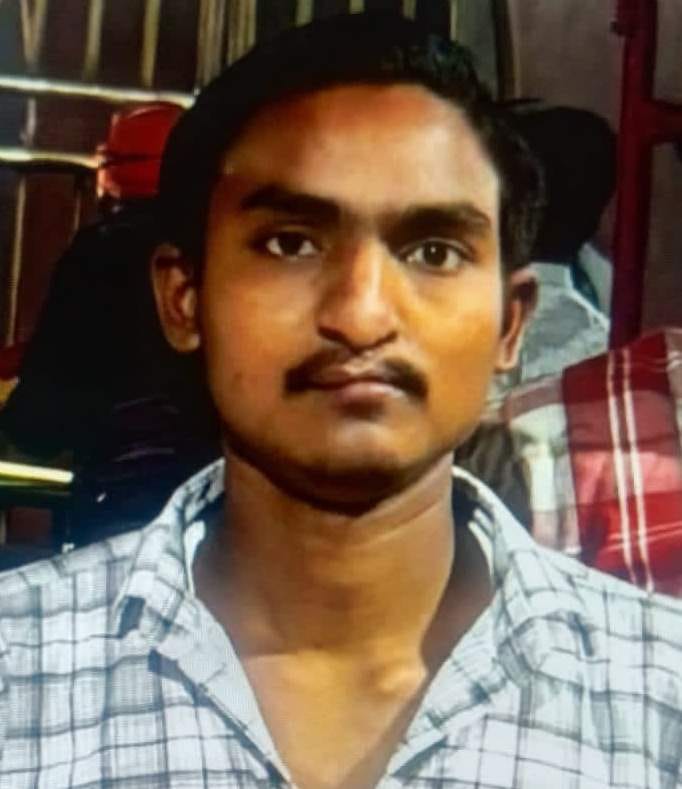 Youth dies after falling while using mobile phone at train doorway.