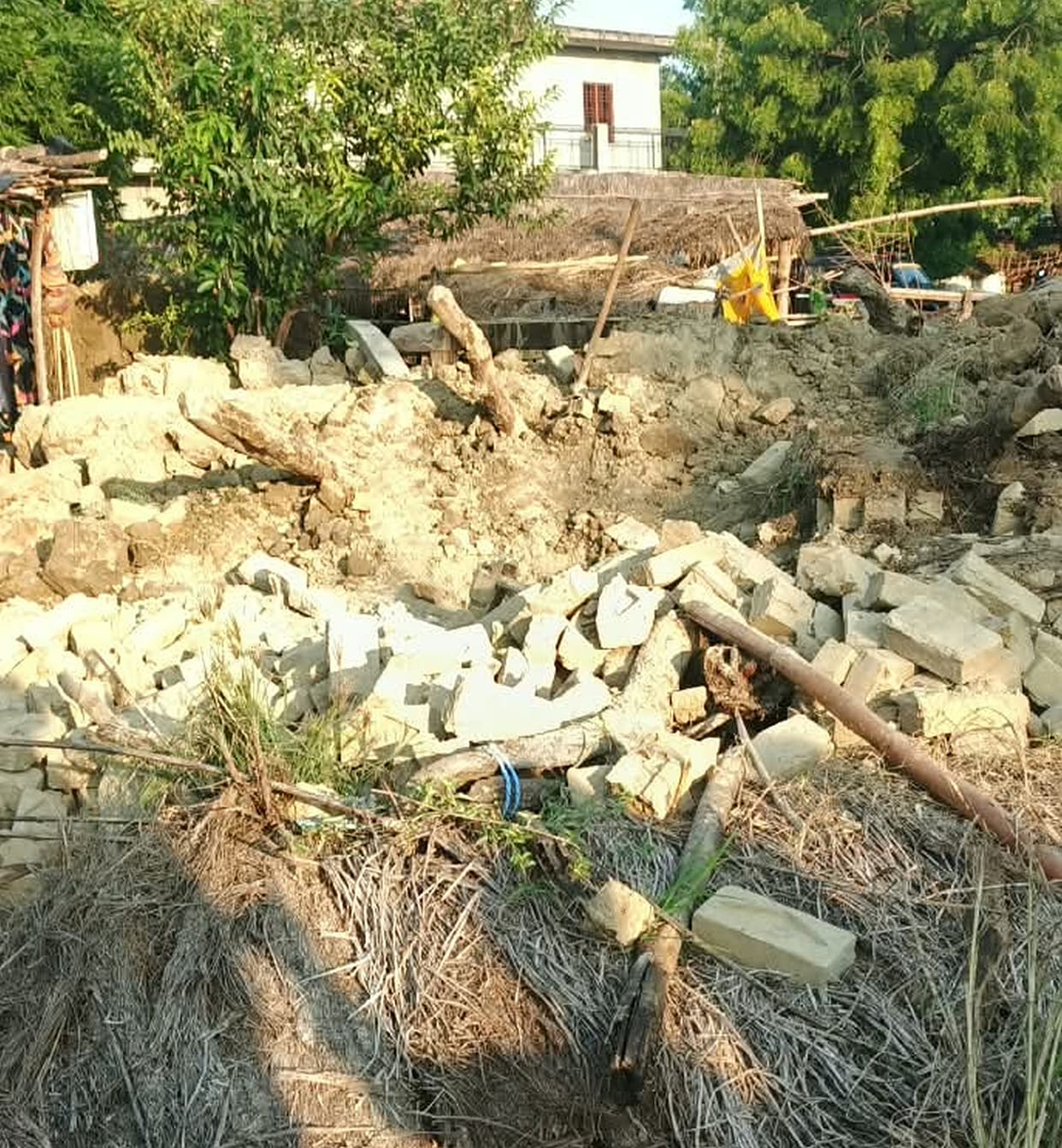 A mud wall collapsed, and an elderly woman died after being buried under the debris.