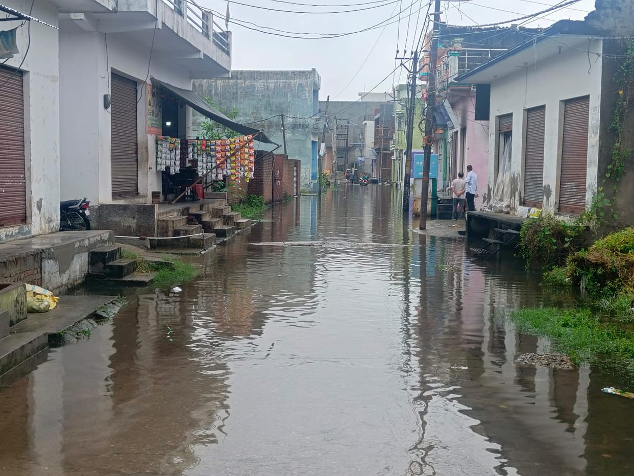 Ikra River in spate, roads in populated areas become canals
