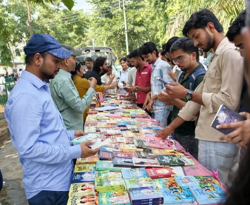 Book exhibition held at the college; students viewed useful books.