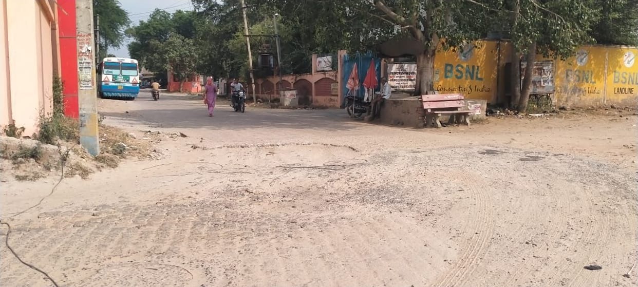 Road riddled with potholes; thousands of people face daily inconvenience.