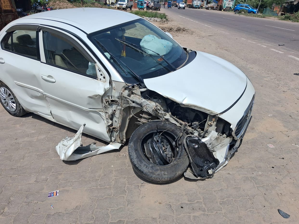 Speeding dumper hits car; two injured.