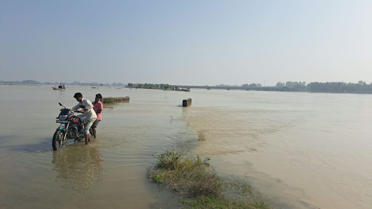 Houses surrounded by floodwaters; escape is nearly impossible as water levels have risen up to neck-deep.